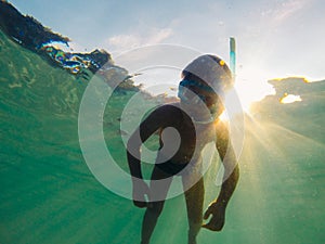 Boy floating in underwater