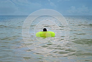 Boy floating in waves at seashore