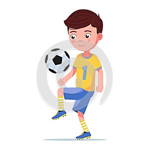 Boy football player kicks the ball