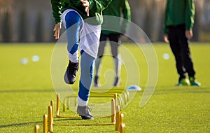 Boy Football Player In Training with Ladder. Young Soccer Players at Training Session