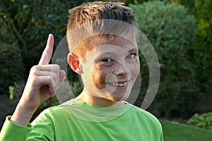 Boy with forefinger gesture