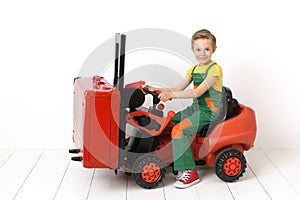 A boy in a forklift.