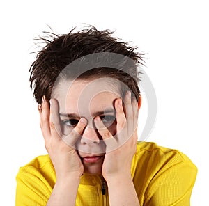 Boy with frightened look in white background