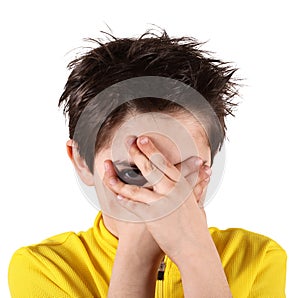 Boy with frightened look in white background