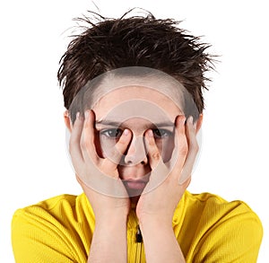 Boy with frightened look in white background