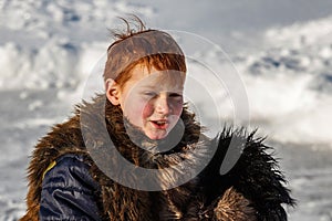 Boy frolic in winter