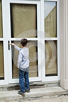 Boy in front of the door