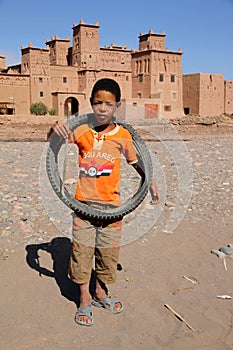 Boy in front of Kasbah in Skoura