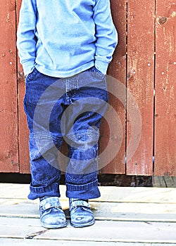 Boy in front of wall