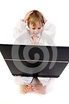 Boy frustrated with laptop