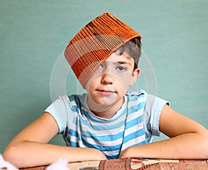Boy with funny headwear as a creative idea photo