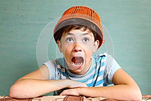 Boy with funny headwear as a creative idea photo