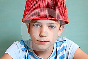 Boy with funny headwear as a creative idea photo