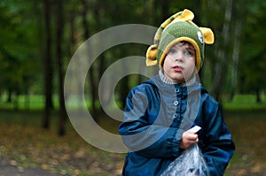 Boy in funny knitted fish hat