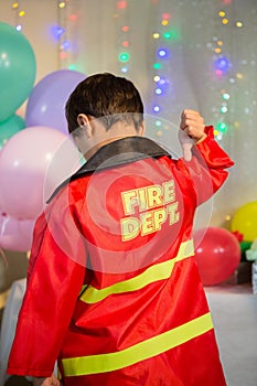 Boy gesturing to the text on protective workwear