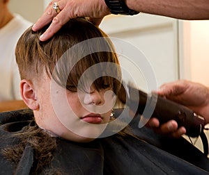 Boy getting a haircut