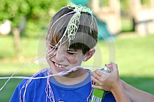 Boy Getting Sprayed photo