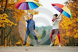 Boy and girl in autumn park