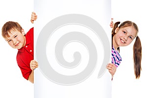 Boy and girl with blank advertising board