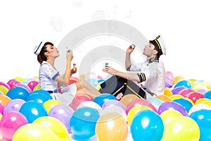 Boy and girl blowing soap bubbles