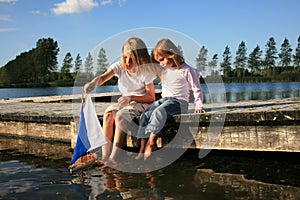 Boy and girl with boat