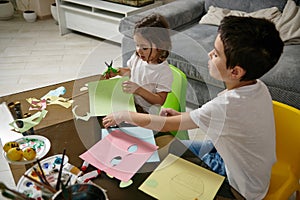 Boy and girl, brother and sister enjoy time for children`s creativity