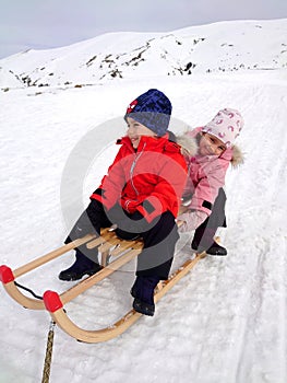 Boy and girl- brothers on slide