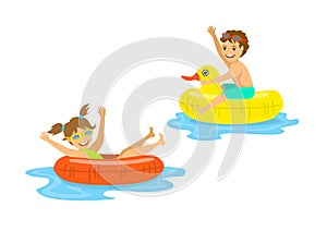 Boy and girl, children floating on inflatable rings