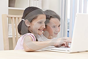 Boy & Girl Children Using Laptop Computer at Home