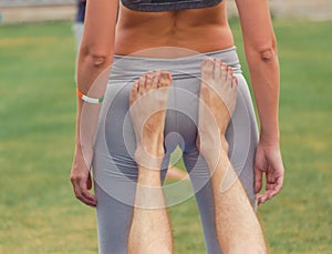 Boy and girl doing yoga in the park