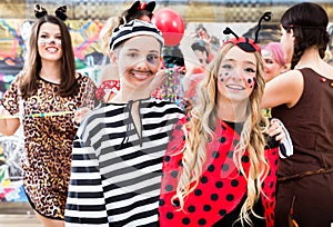 Boy and girl dresses as ladybird and prisoner at German fastnach