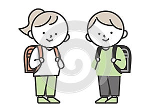 Boy and girl elementary school students carrying school bags