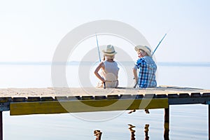 Boy and girl with fishing rods