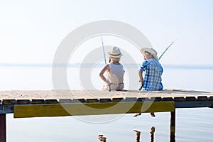 Boy and girl with fishing rods