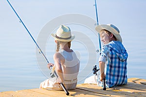 Boy and girl with fishing rods