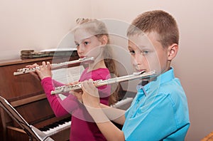 Boy, girl and flute