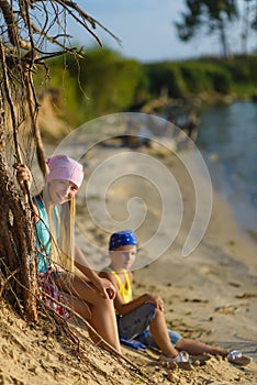 Boy and girl go down the sand to the beach. Adventure, travel, tourism concept