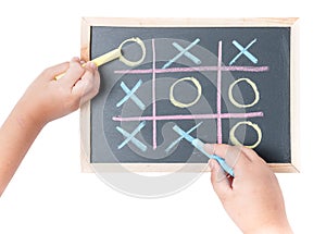Boy and girl hand drawing a game of tic tac toe