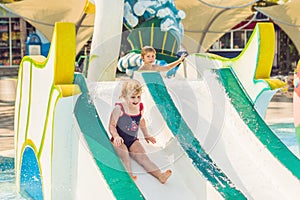 Boy and girl have fun in the water park