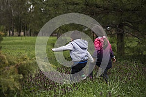 Boy and girl having fun, exploring nature