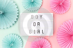 Boy or girl. Lightbox with letters and tissue paper fans.
