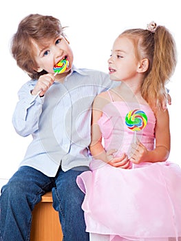 Boy and girl with lollipops