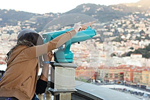 Boy and Girl looking through a telescope