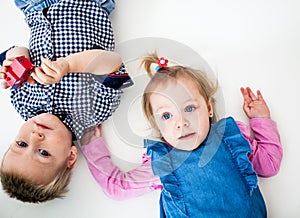 The boy and girl lying isolated