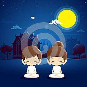 Boy and girl meditating at temple with night scene.