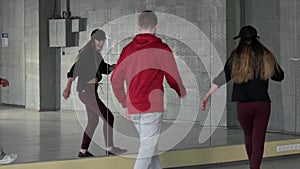 Boy and girl performing modern dance movement.