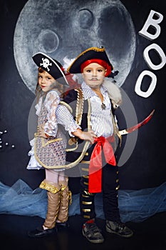 Boy and girl in pirate costumes. Halloween Concept