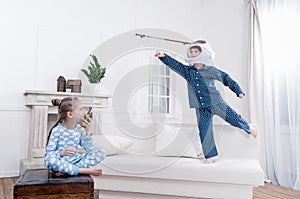 Boy and girl playing cosmonauts together