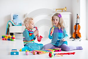 Boy and girl playing flute