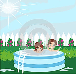 Boy and girl playing in inflatable baby pool